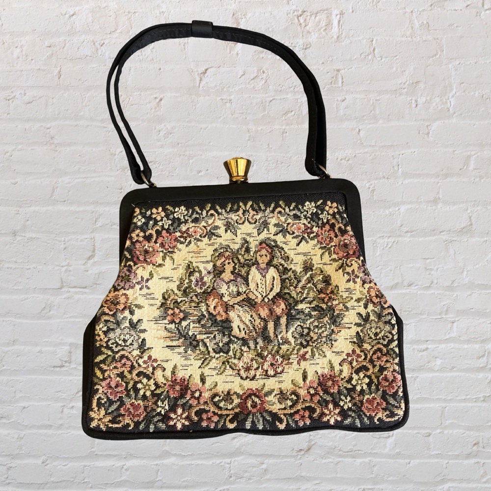 Vintage tapestry handbag with short strap, featuring beautiful tapestry design.